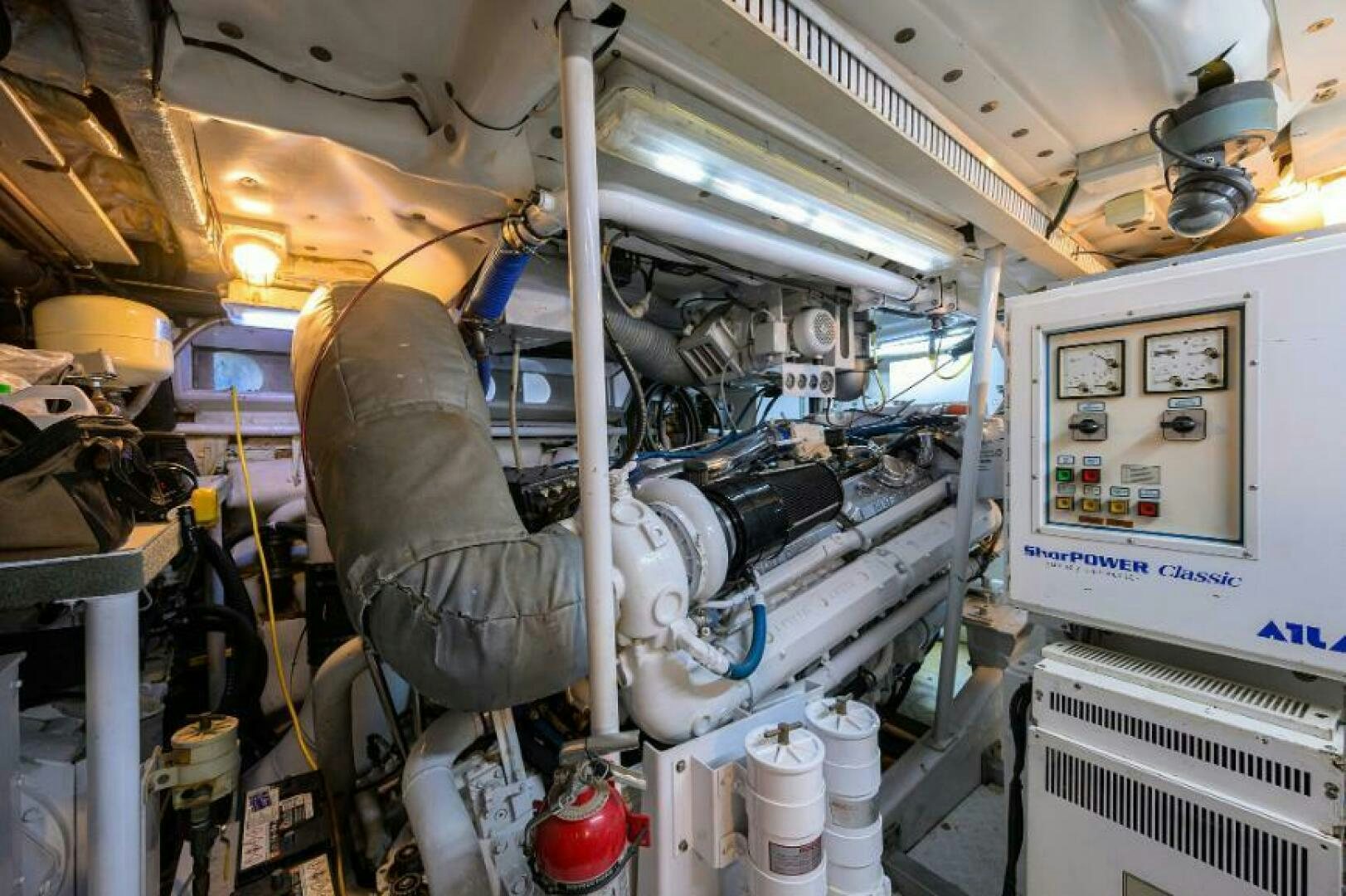 a person working on a machine aboard CIPANGO Yacht for Sale