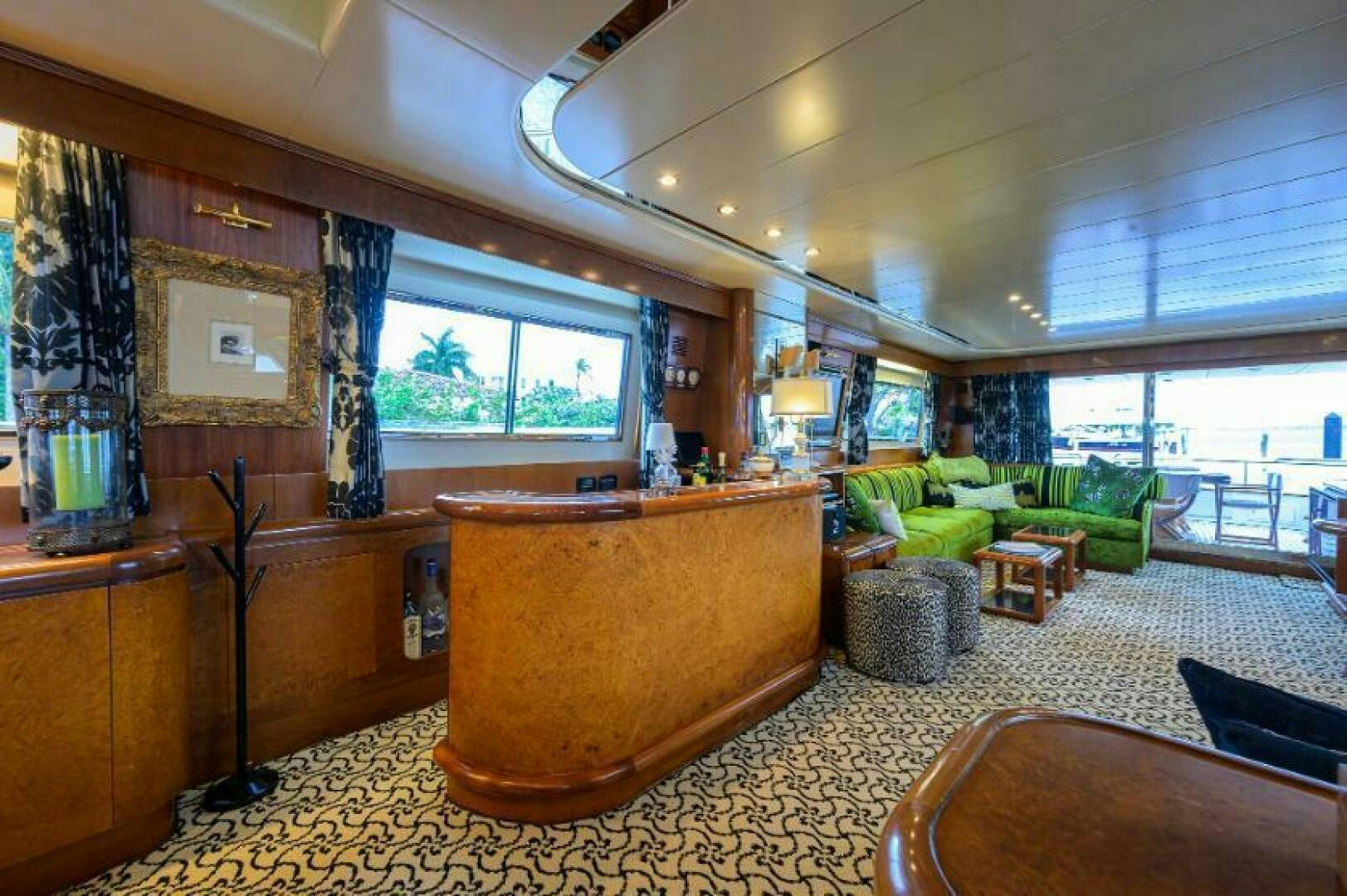 a room with a couch and a table aboard CIPANGO Yacht for Sale
