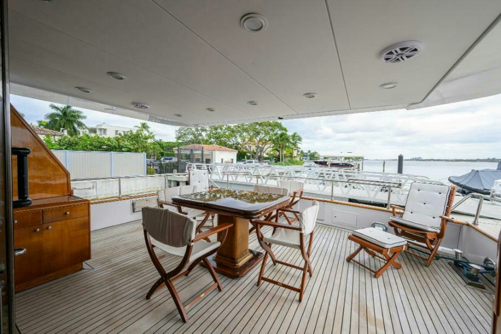 a room with a table chairs and a large window aboard CIPANGO Yacht for Sale