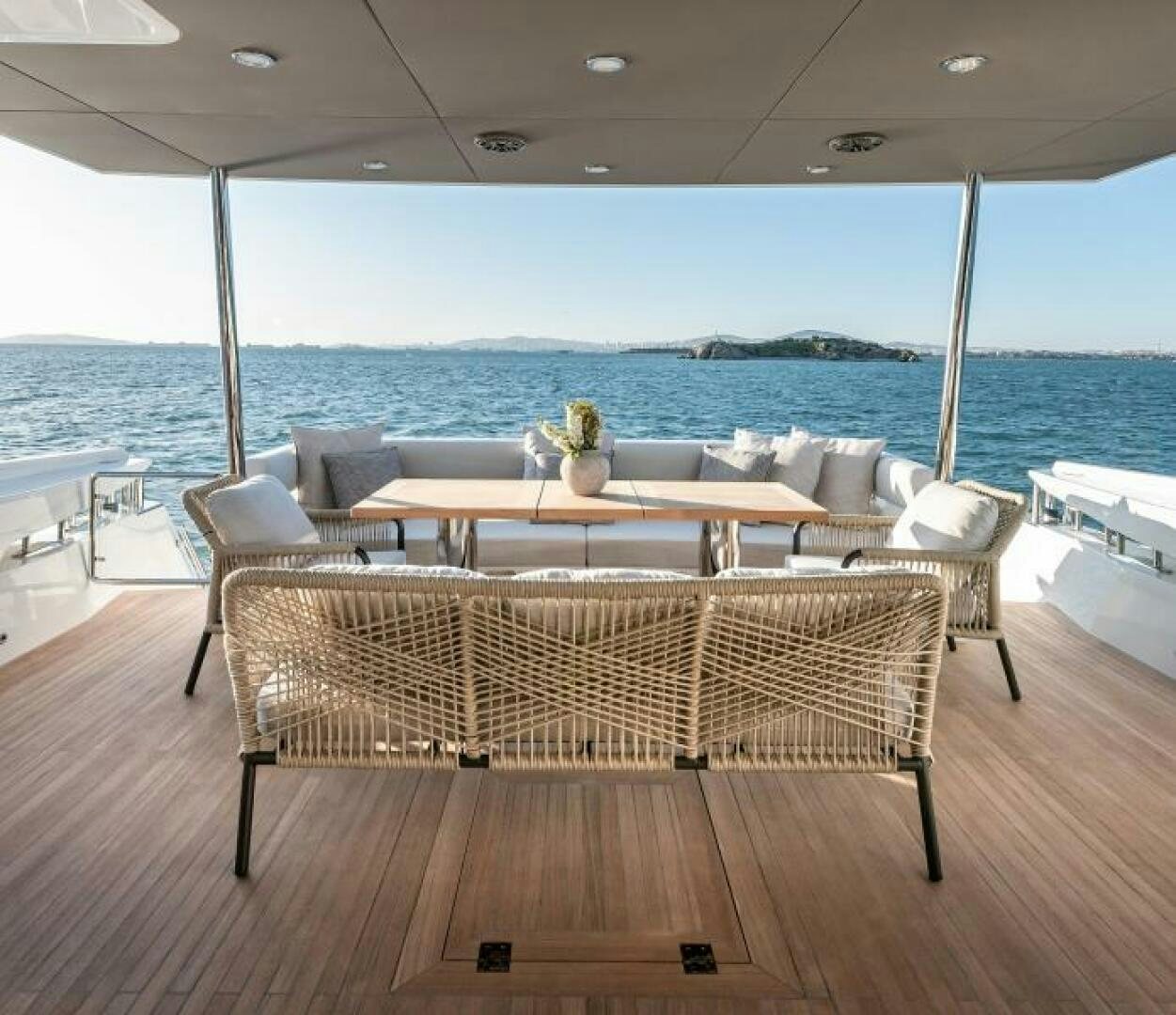 a table and chairs on a deck aboard NUMARINE 22XP/07 Yacht for Sale