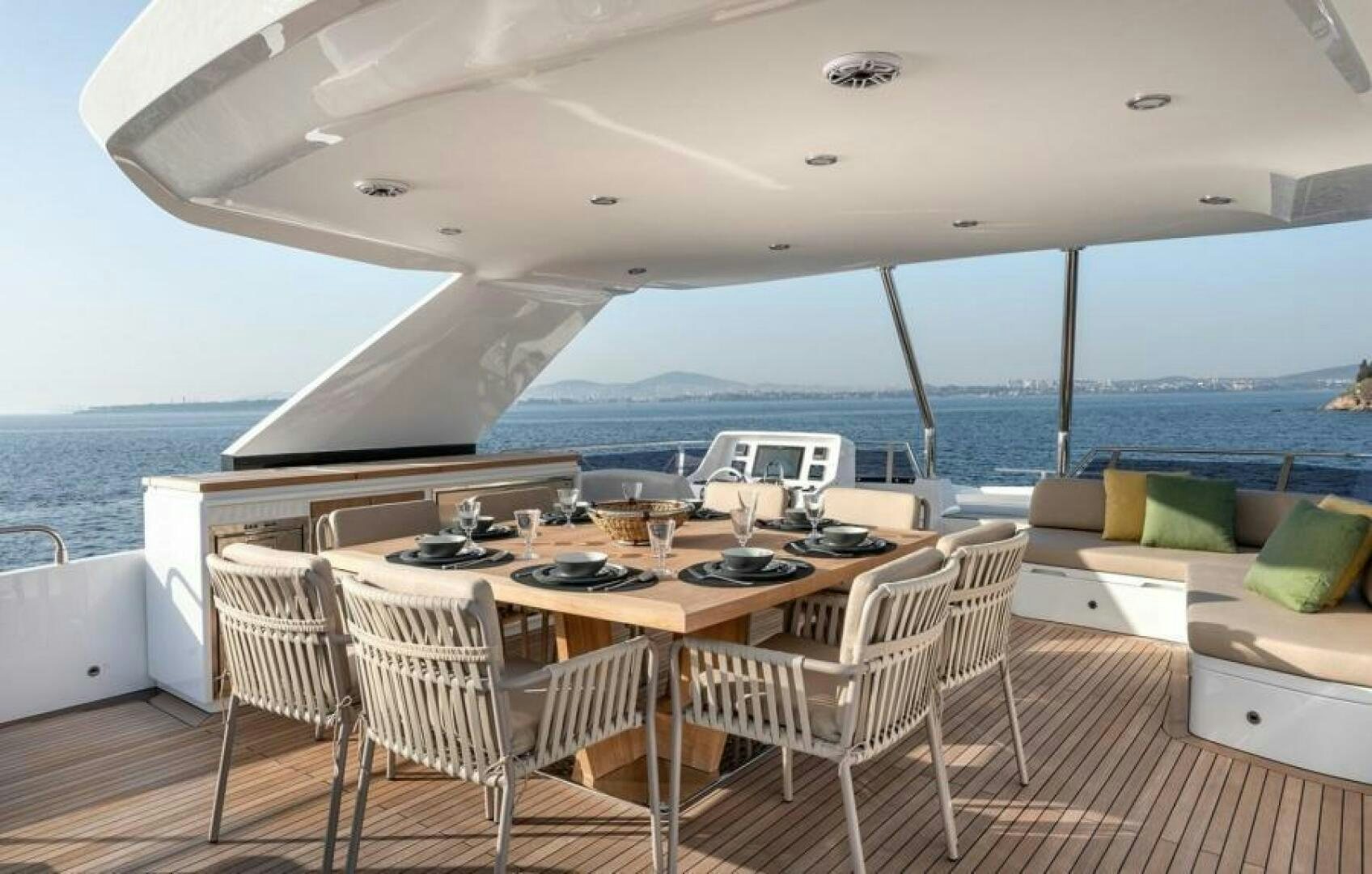 a large dining table on a boat aboard NUMARINE 22XP/07 Yacht for Sale