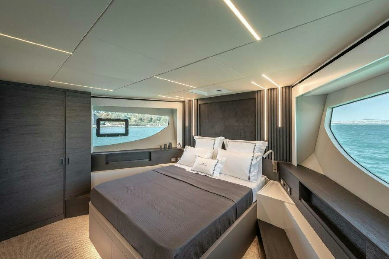 a room with a bed and a window aboard NUMARINE 22XP/07 Yacht for Sale