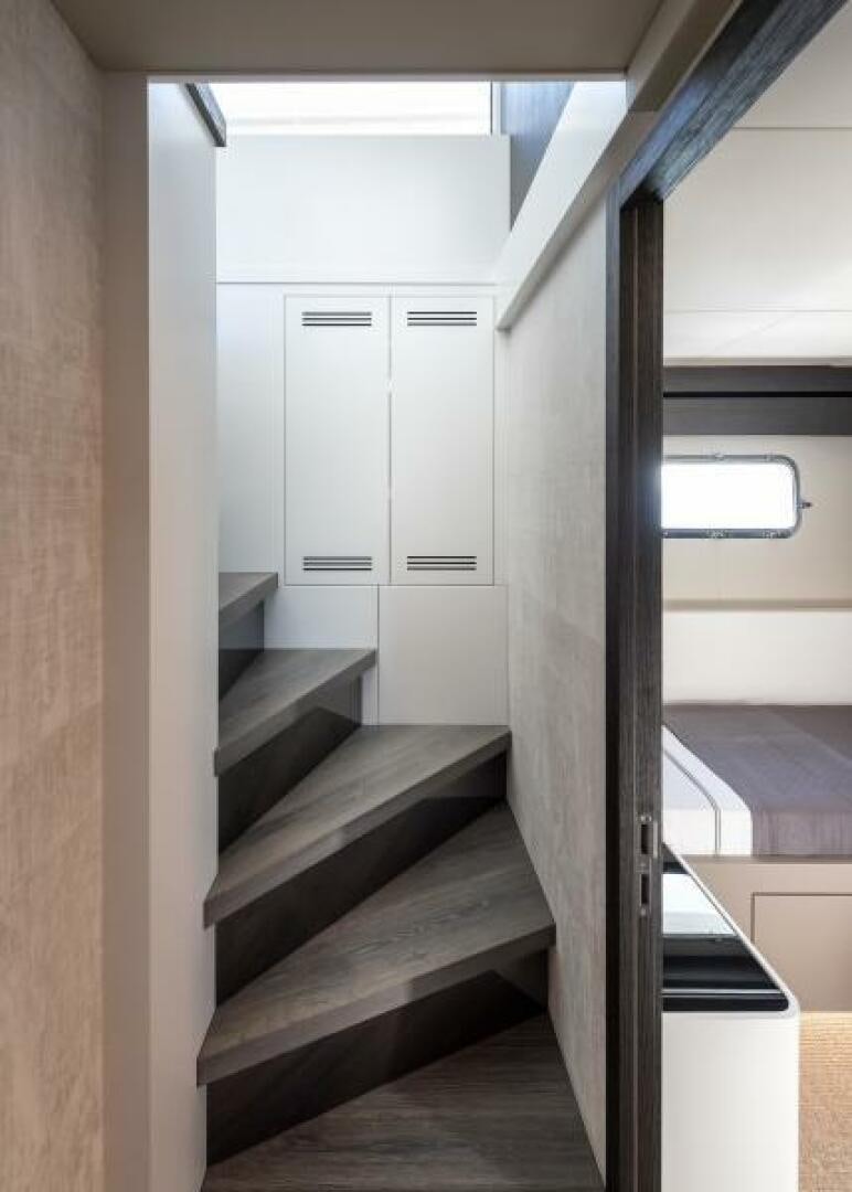 a room with a staircase and a window aboard NUMARINE 22XP/07 Yacht for Sale