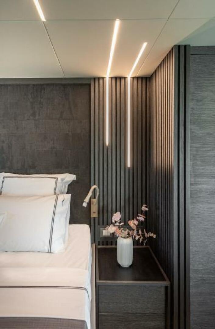 a room with a table and couch aboard NUMARINE 22XP/07 Yacht for Sale