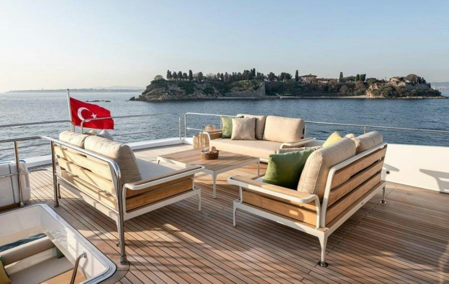 a deck with chairs and a table on it aboard NUMARINE 22XP/07 Yacht for Sale