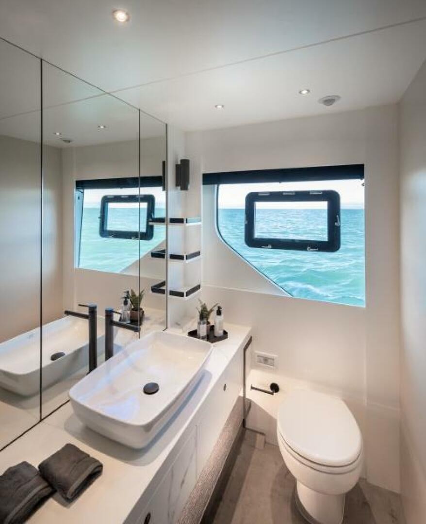 a bathroom with a large window aboard NUMARINE 22XP/07 Yacht for Sale