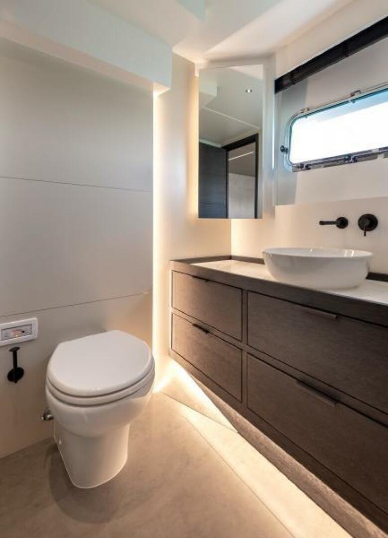 a bathroom with a sink and a toilet aboard NUMARINE 22XP/07 Yacht for Sale