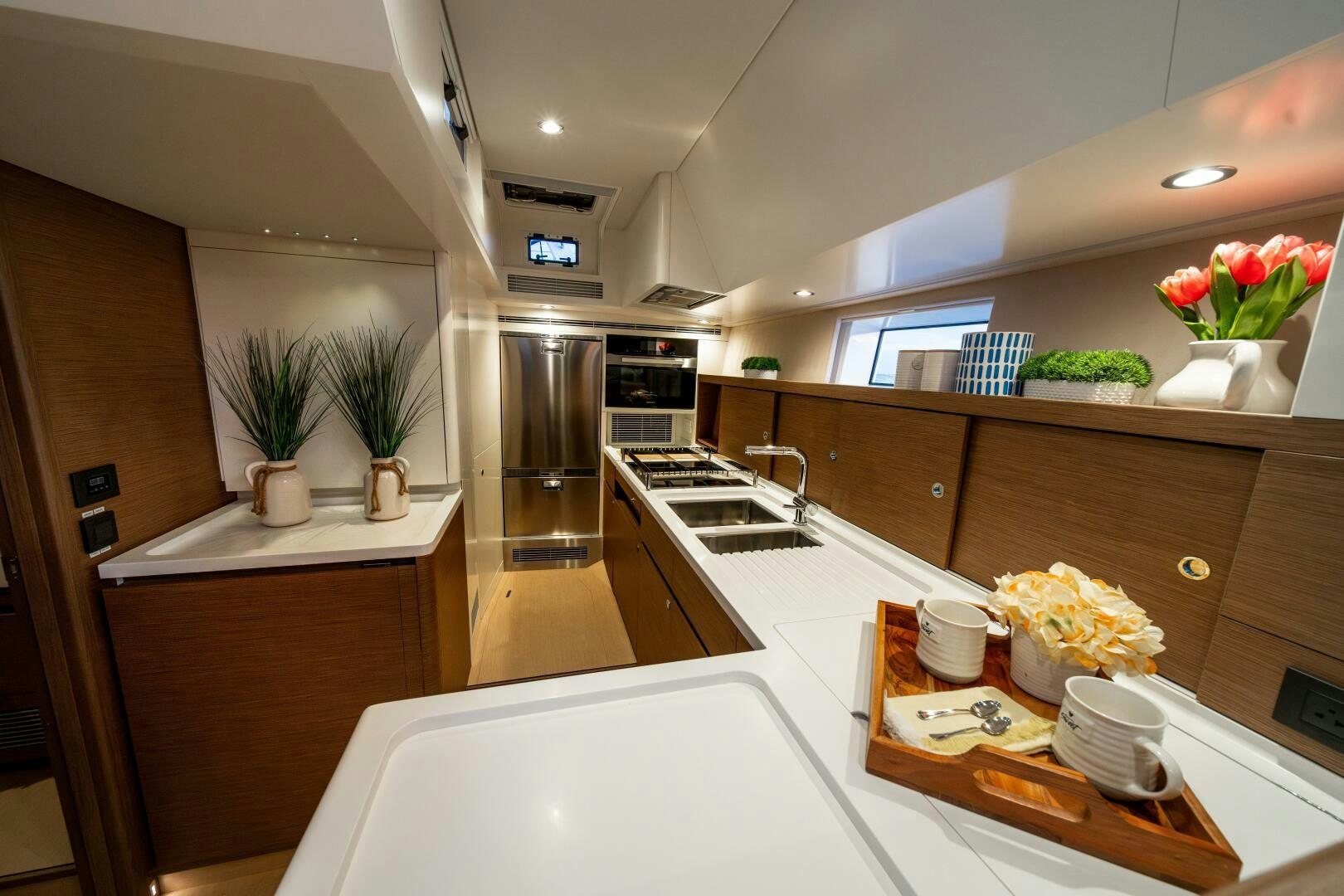 a kitchen with a large island aboard FORTITUDE Yacht for Sale
