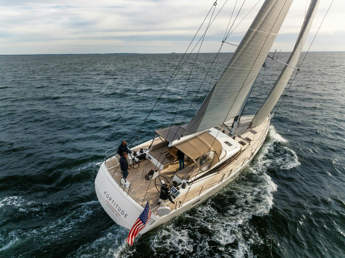 a group of people sailing on a boat in the ocean aboard FORTITUDE Yacht for Sale
