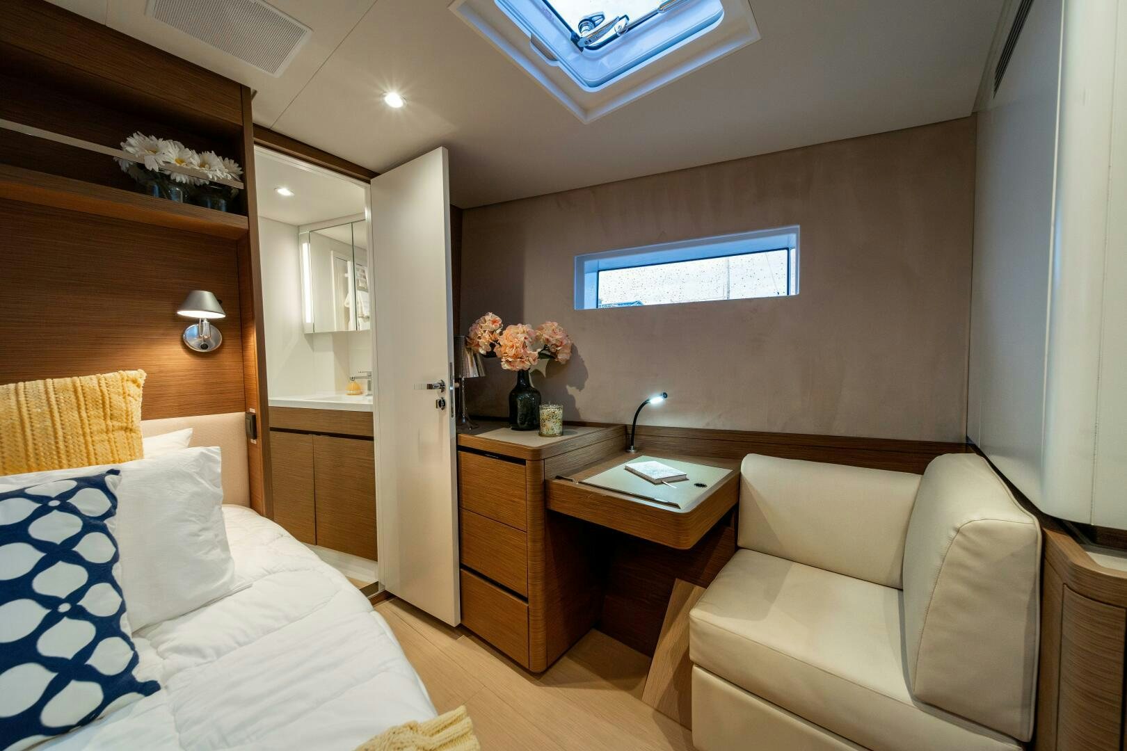 a room with a bed and a desk aboard FORTITUDE Yacht for Sale