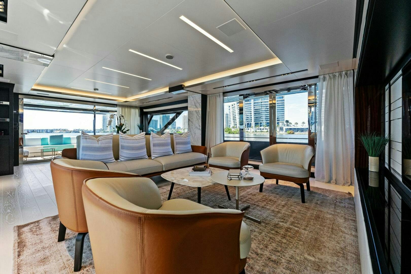 a living room with a large window aboard CORSARO SUPER Yacht for Sale