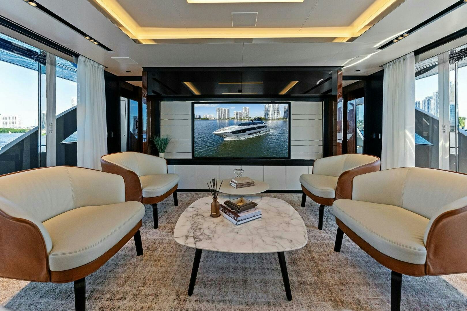 a room with a table and chairs aboard CORSARO SUPER Yacht for Sale
