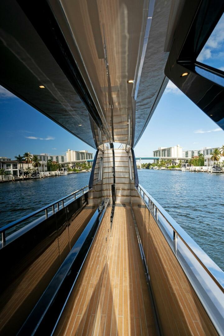 a deck with a view of a city and water aboard CORSARO SUPER Yacht for Sale