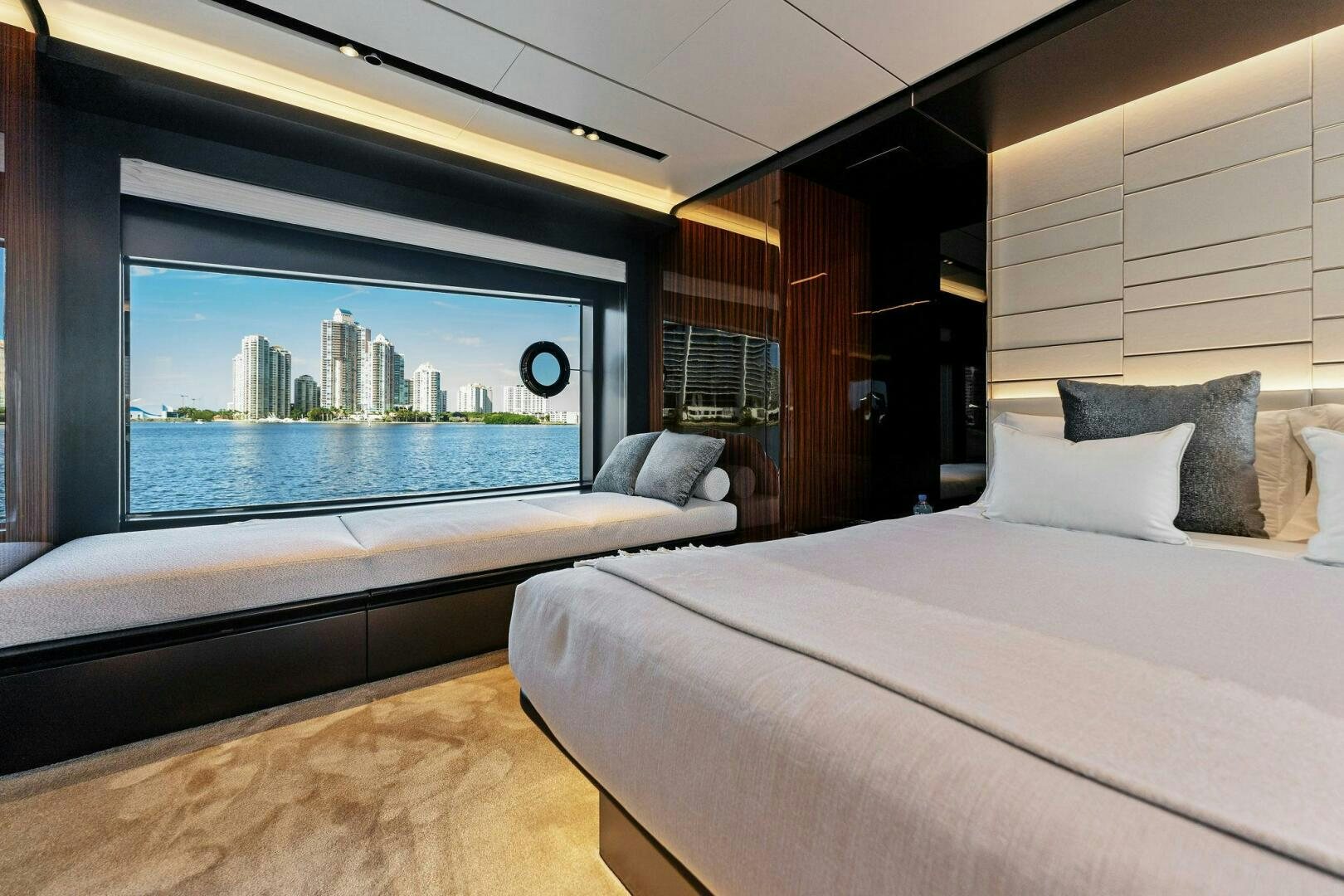 a room with a bed and a large window aboard CORSARO SUPER Yacht for Sale