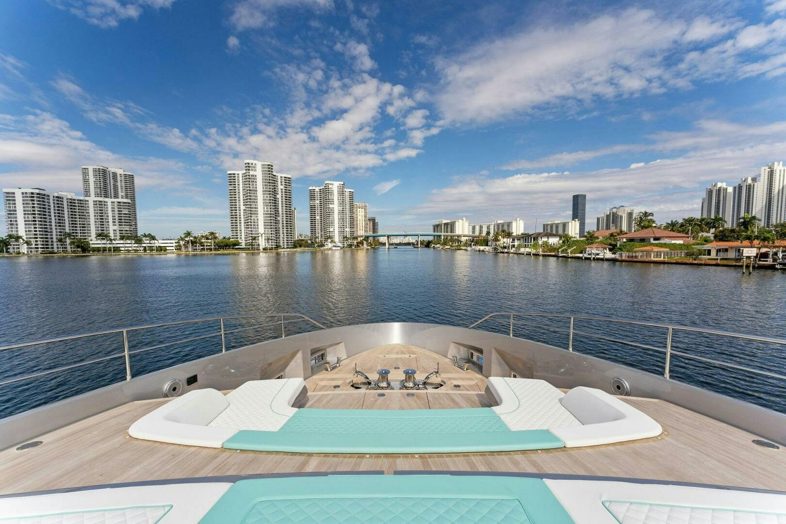 a deck with a view of a city and water aboard CORSARO SUPER Yacht for Sale