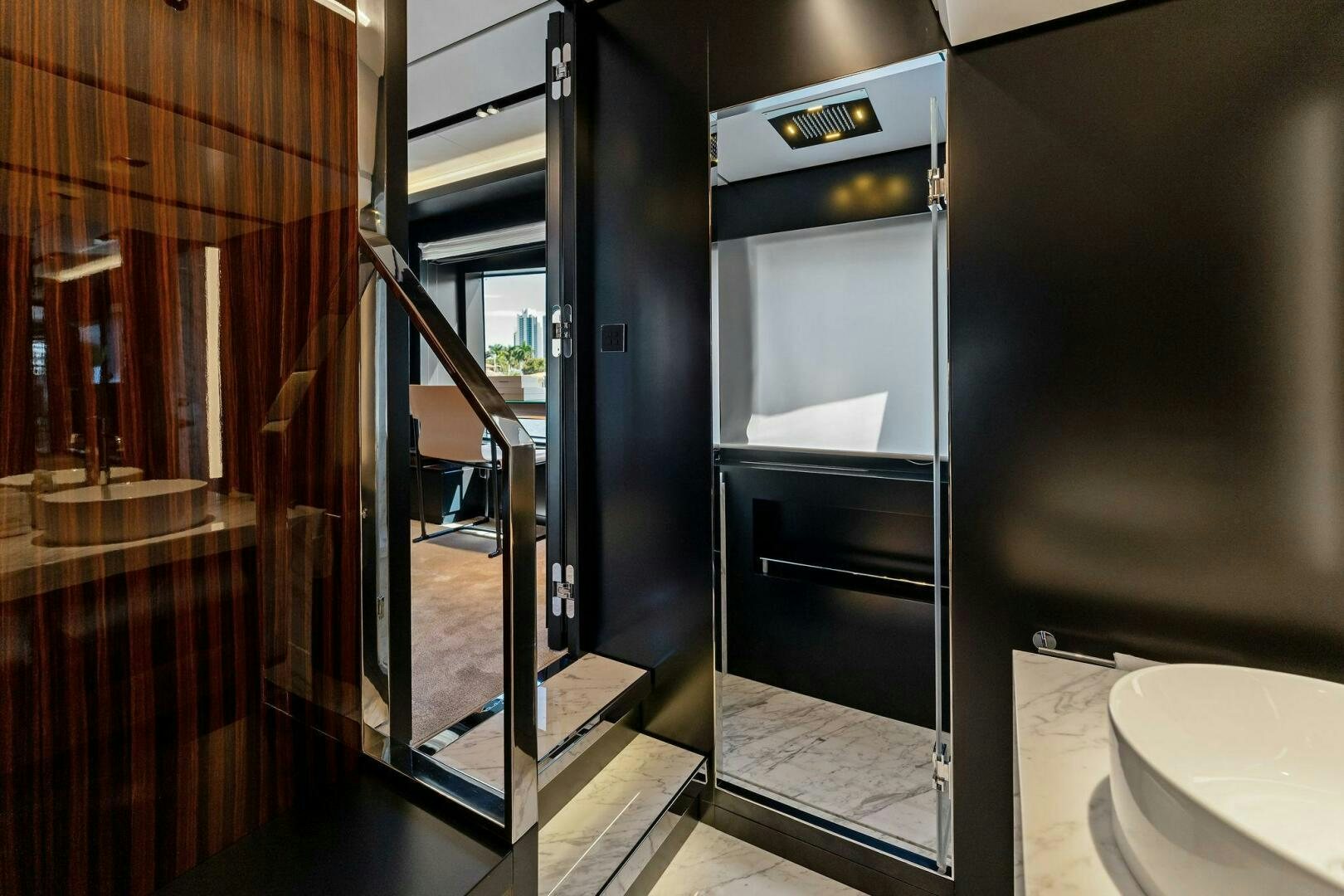 a room with a glass door aboard CORSARO SUPER Yacht for Sale