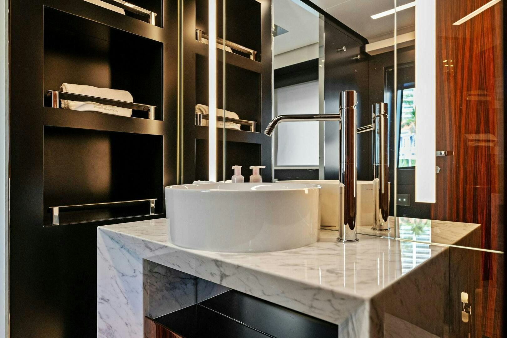 a bathroom with a sink and a mirror aboard CORSARO SUPER Yacht for Sale
