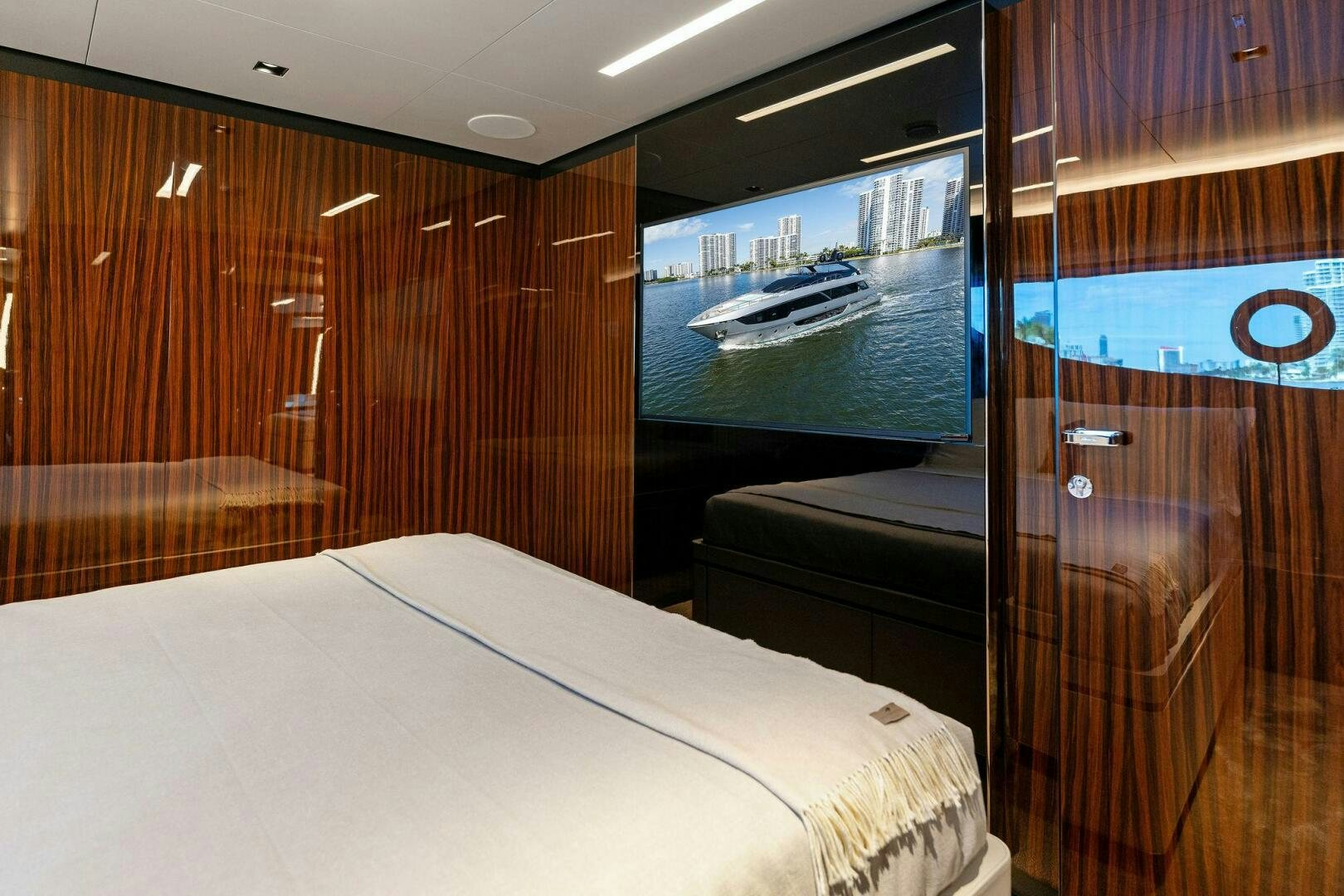 a room with a bed and a door aboard CORSARO SUPER Yacht for Sale