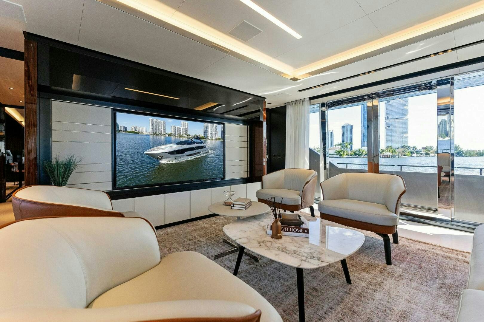 a living room with a large glass window aboard CORSARO SUPER Yacht for Sale