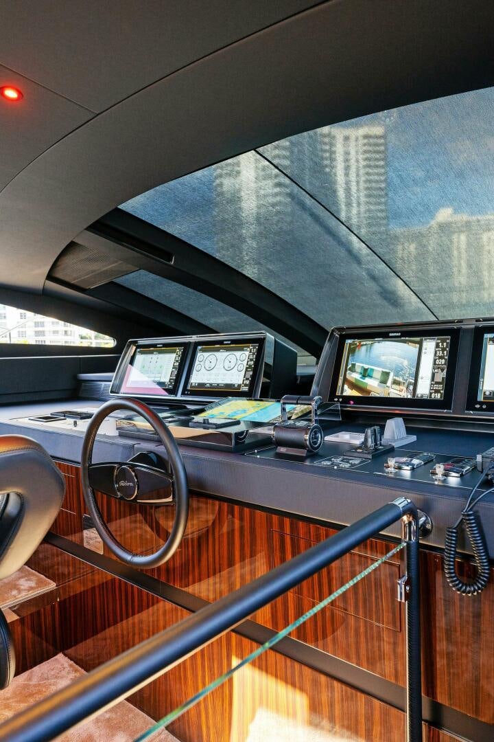 a desk with computers and monitors aboard CORSARO SUPER Yacht for Sale