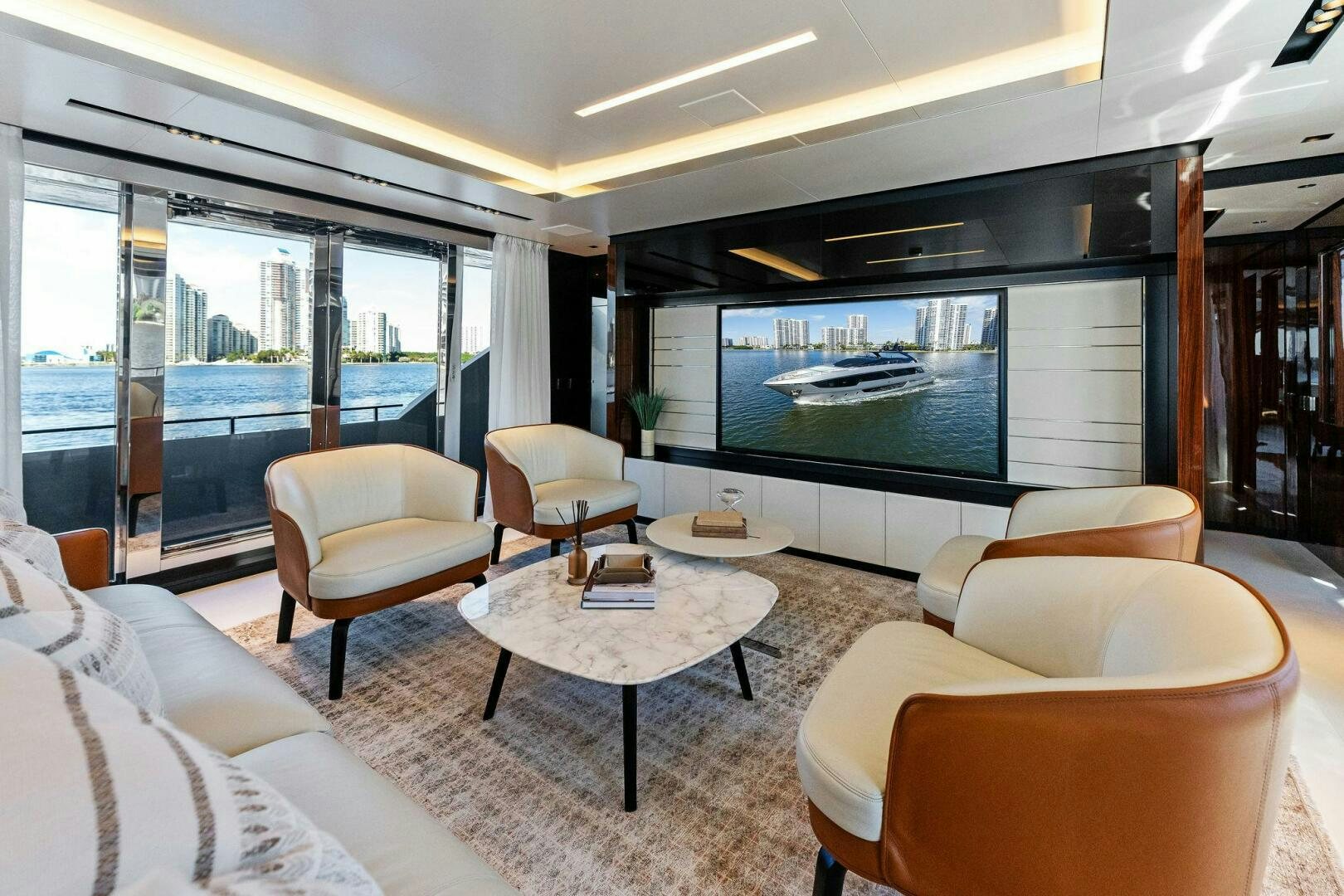 a living room with a large tv aboard CORSARO SUPER Yacht for Sale