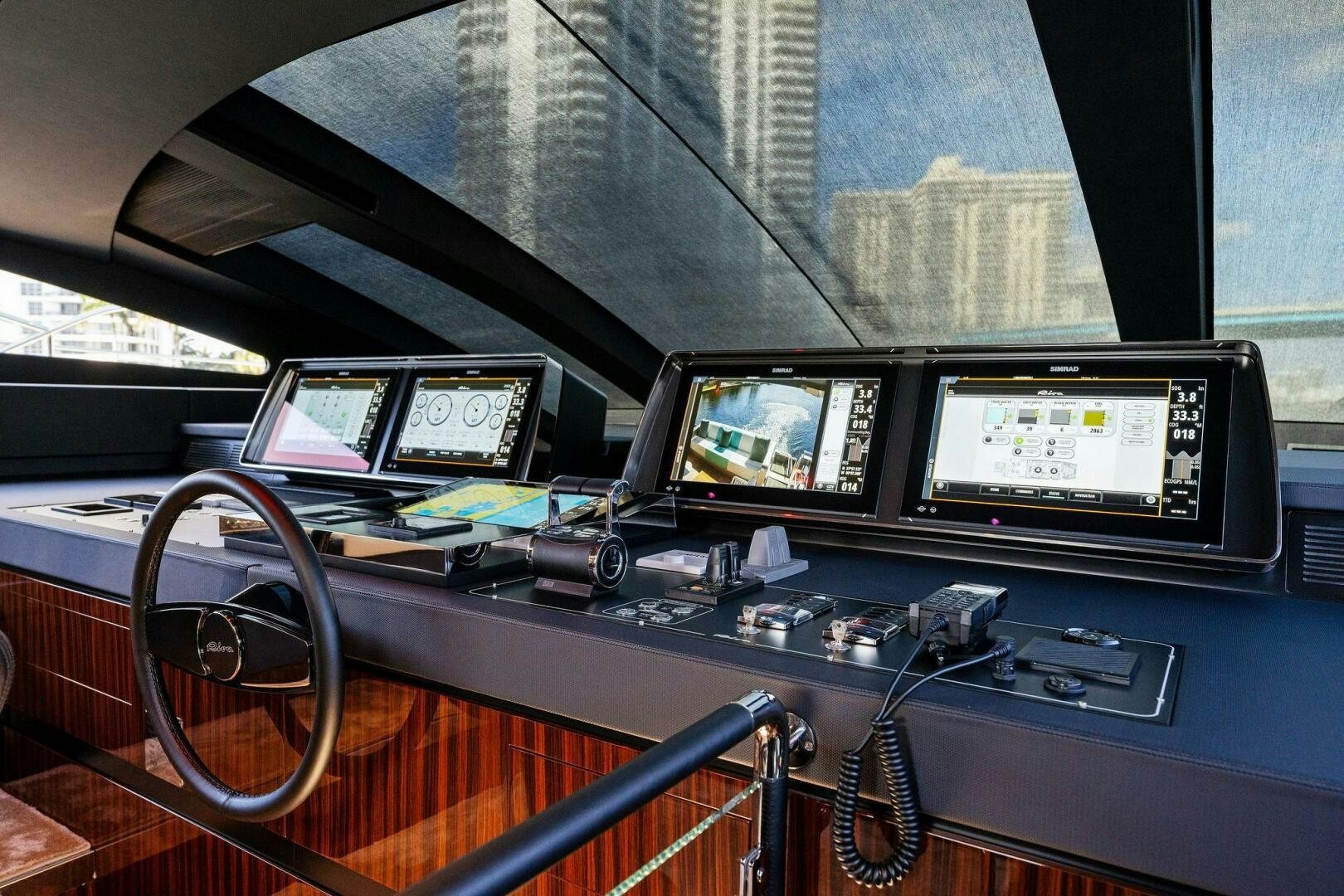 a group of monitors and electronics on a table aboard CORSARO SUPER Yacht for Sale
