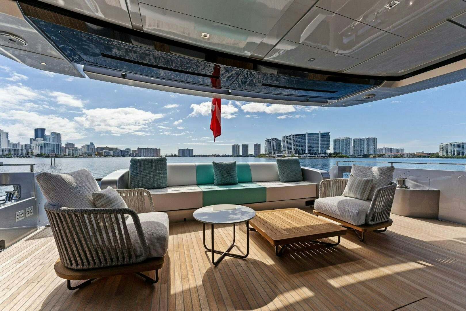 a large room with a couch and a table and chairs aboard CORSARO SUPER Yacht for Sale