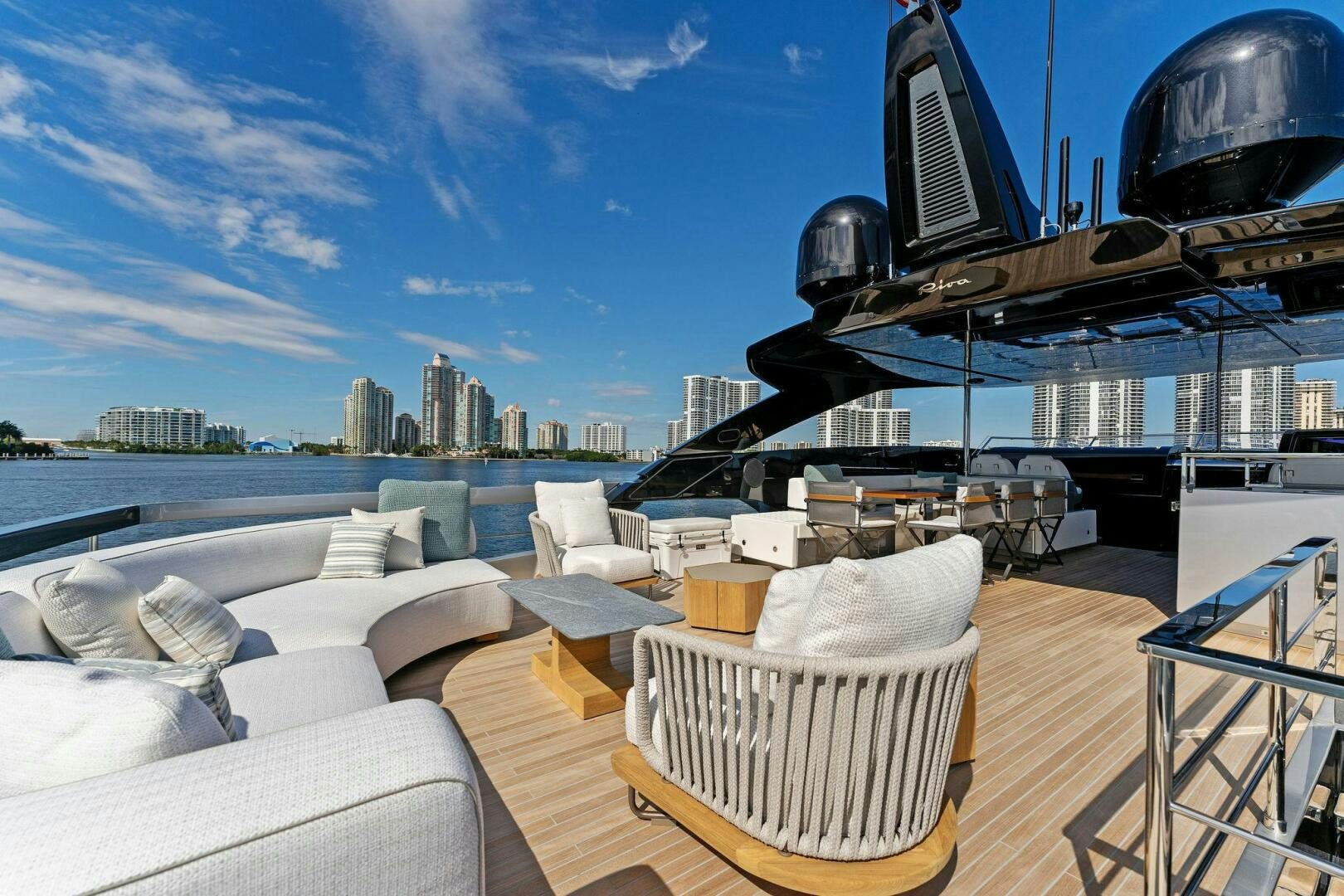 a deck with a view of a city and a large body of water aboard CORSARO SUPER Yacht for Sale