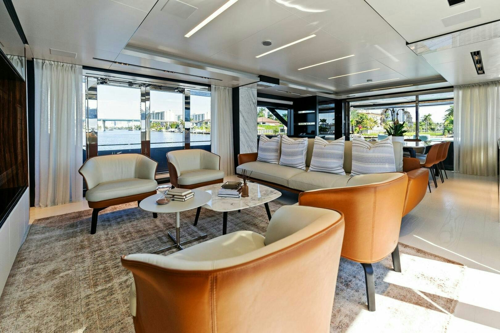 a living room with a large window aboard CORSARO SUPER Yacht for Sale