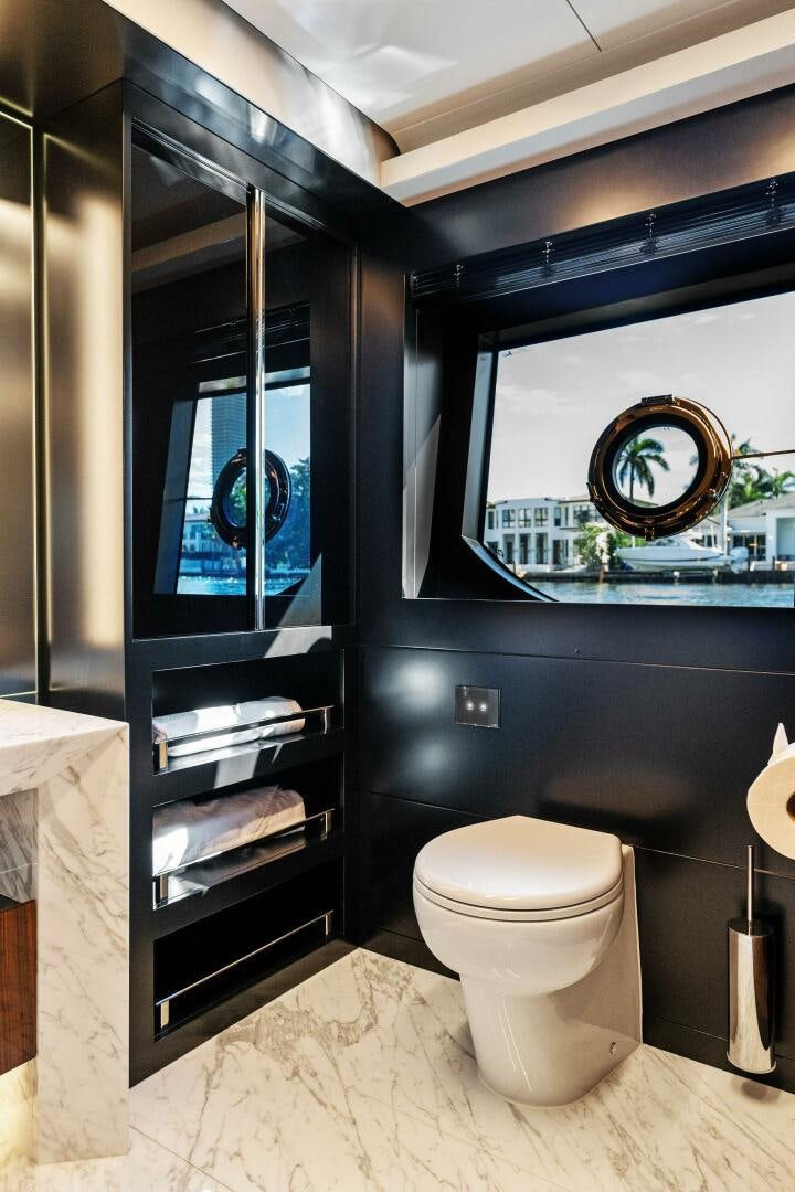 a bathroom with a mirror and a toilet aboard CORSARO SUPER Yacht for Sale