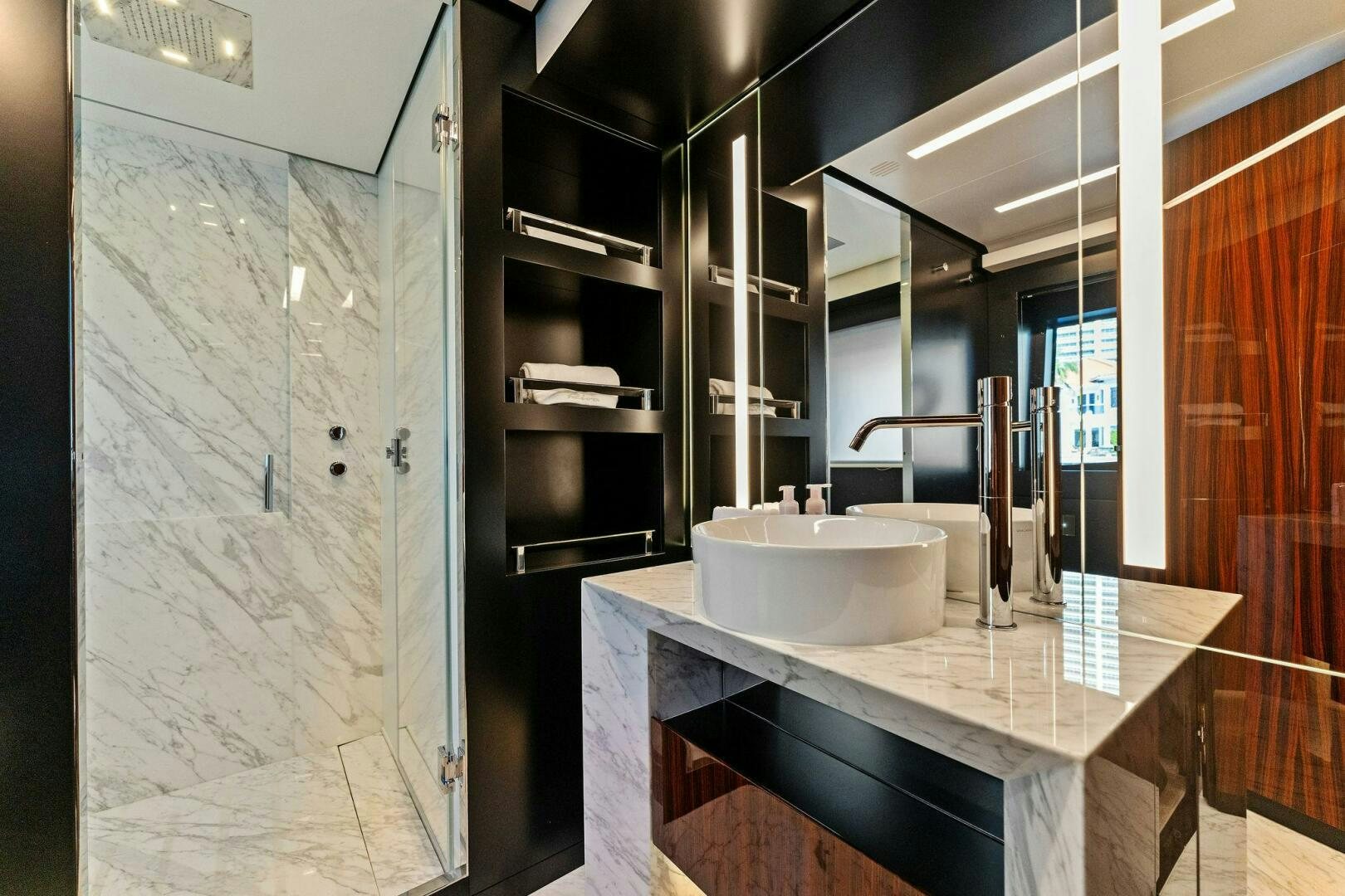 a bathroom with a sink and a mirror aboard CORSARO SUPER Yacht for Sale