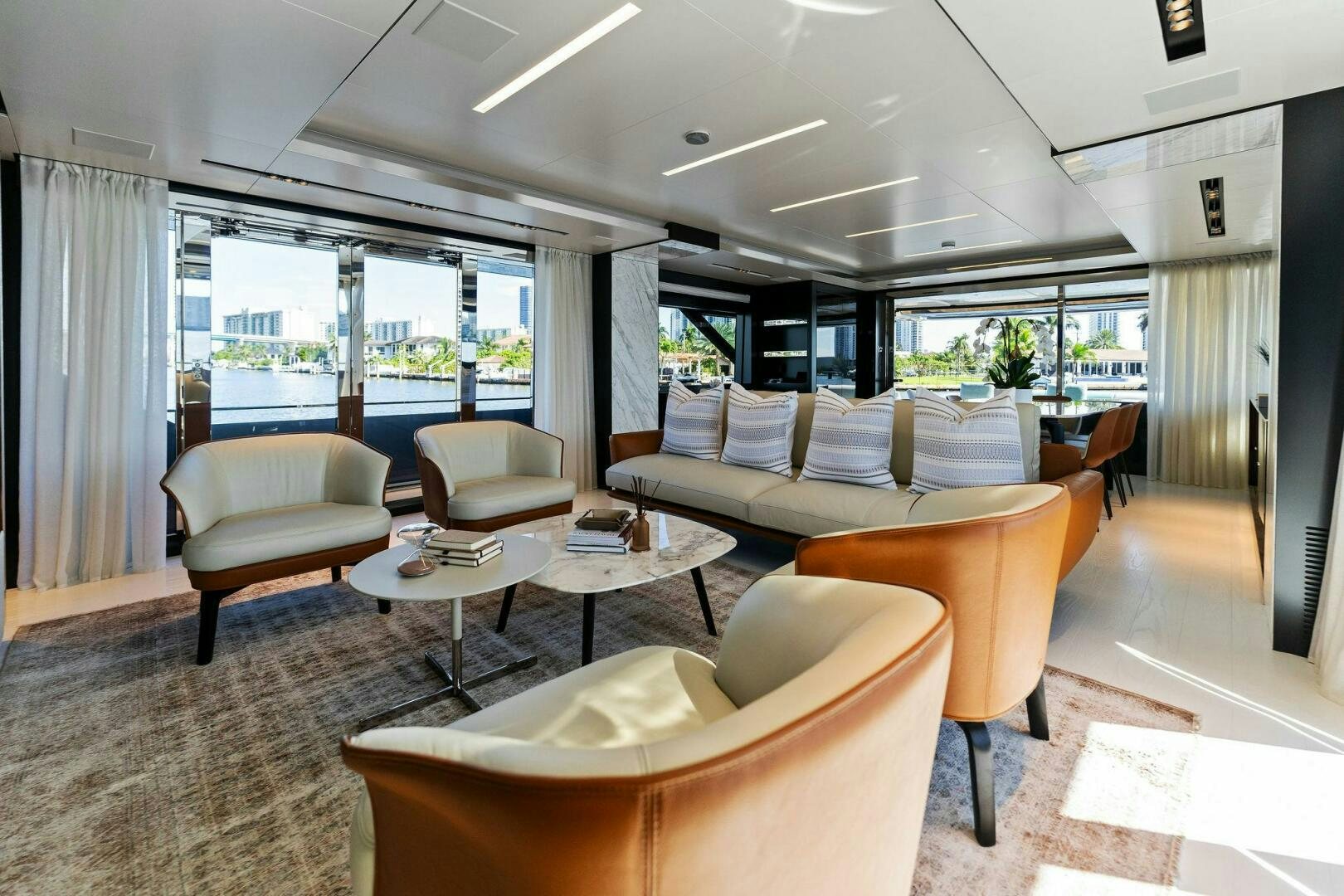 a living room with a large window aboard CORSARO SUPER Yacht for Sale