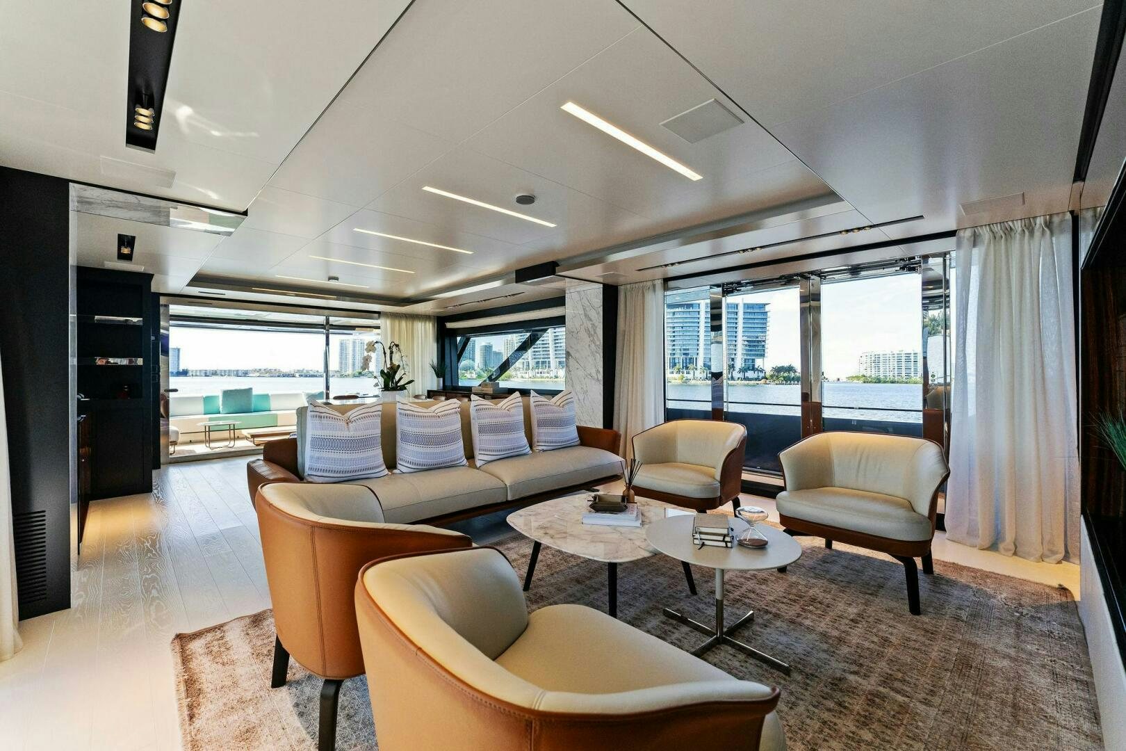 a living room with a large window aboard CORSARO SUPER Yacht for Sale