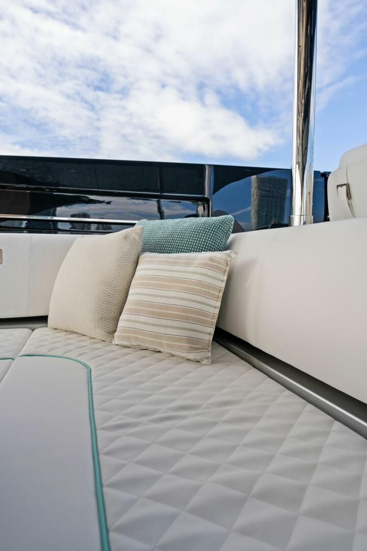 a bed with pillows on it aboard CORSARO SUPER Yacht for Sale
