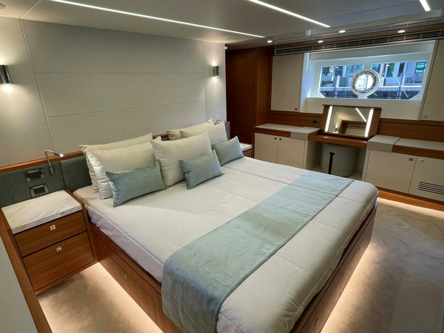 a bed in a room aboard NEW 70 JOHNSON Yacht for Sale