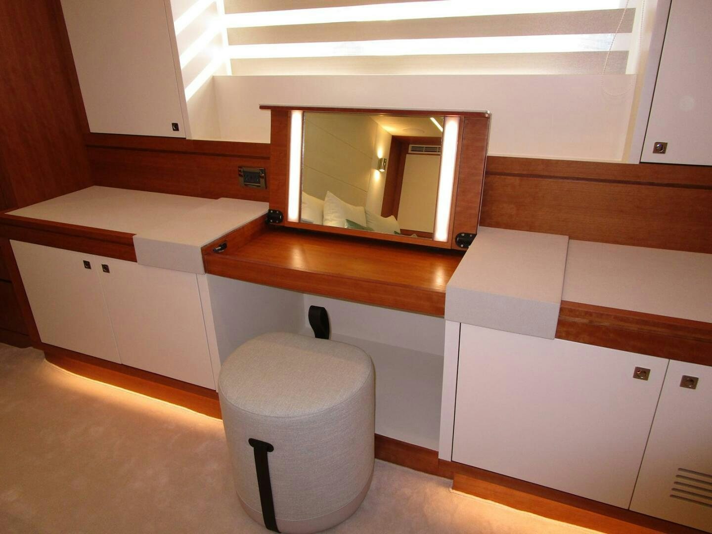 a bathroom with a mirror and a toilet aboard NEW 70 JOHNSON Yacht for Sale
