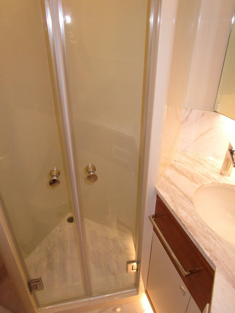 a shower unit in a bathroom aboard NEW 70 JOHNSON Yacht for Sale