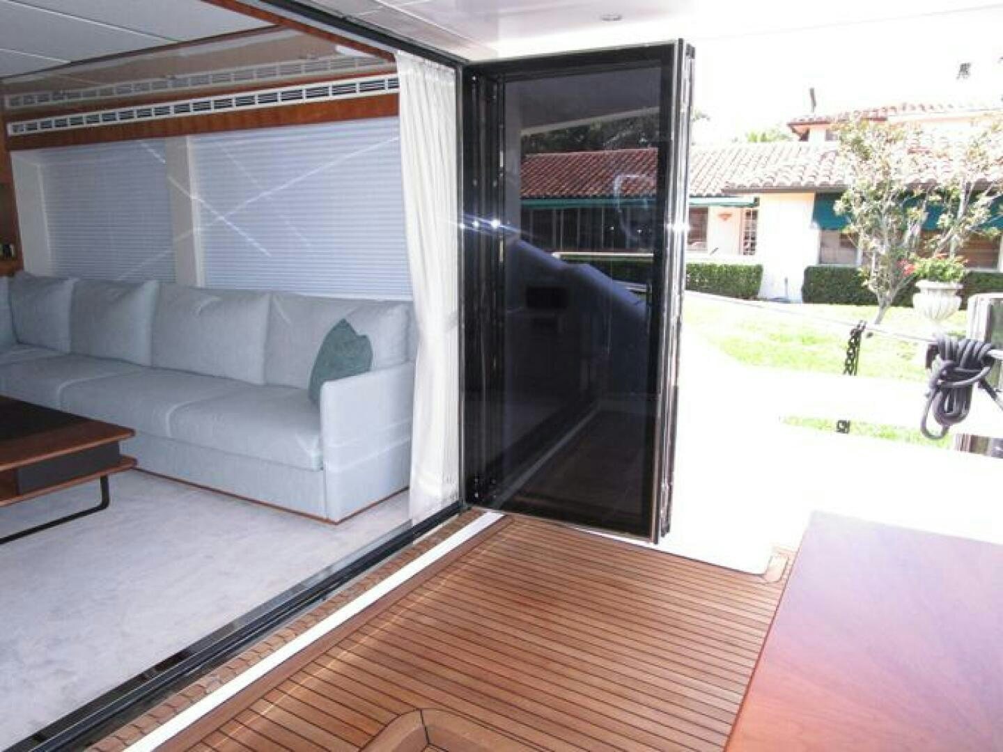 a living room with a couch and a table aboard NEW 70 JOHNSON Yacht for Sale