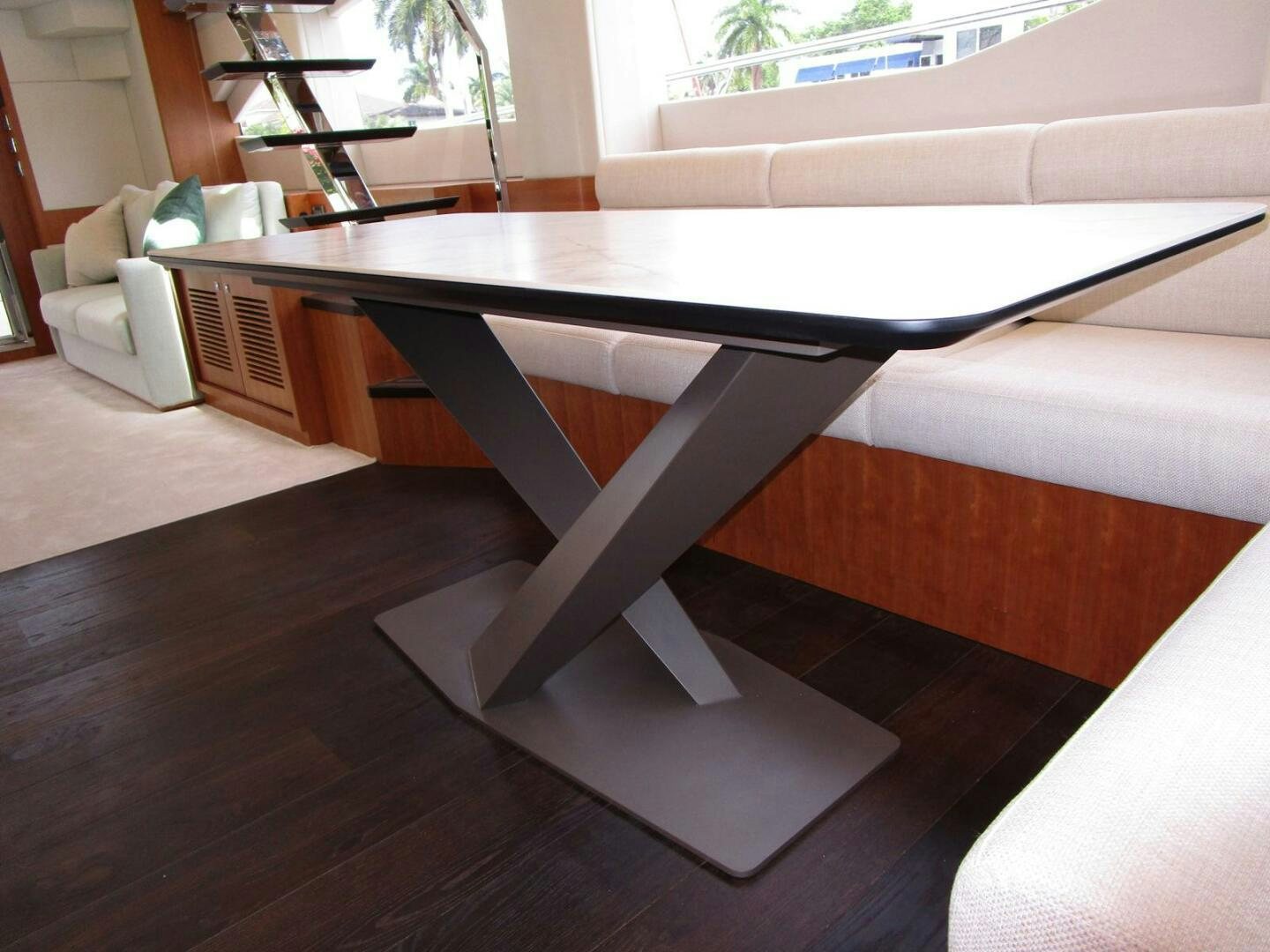 a table with a couch aboard NEW 70 JOHNSON Yacht for Sale