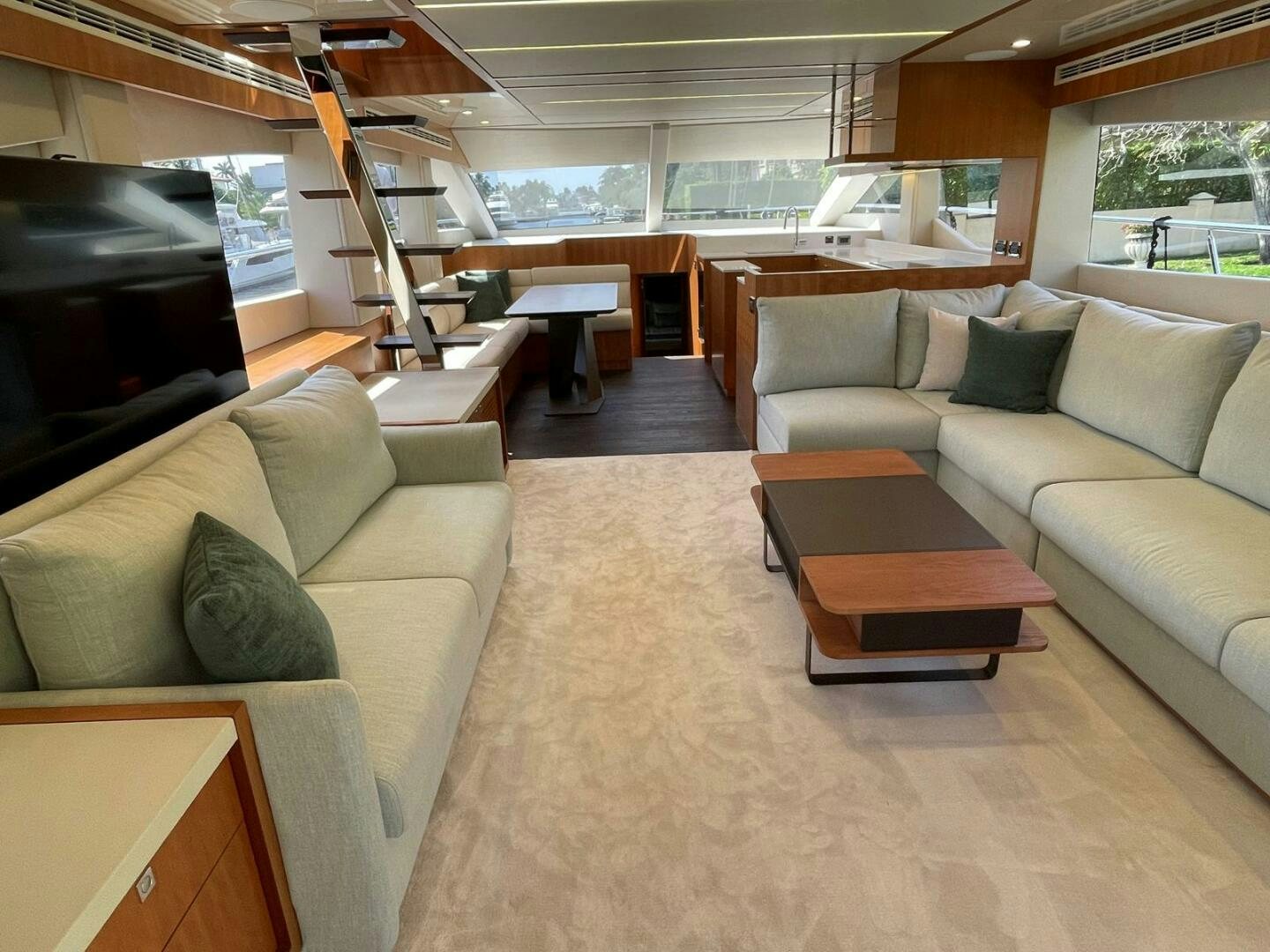 a living room with a couch and a tv aboard NEW 70 JOHNSON Yacht for Sale