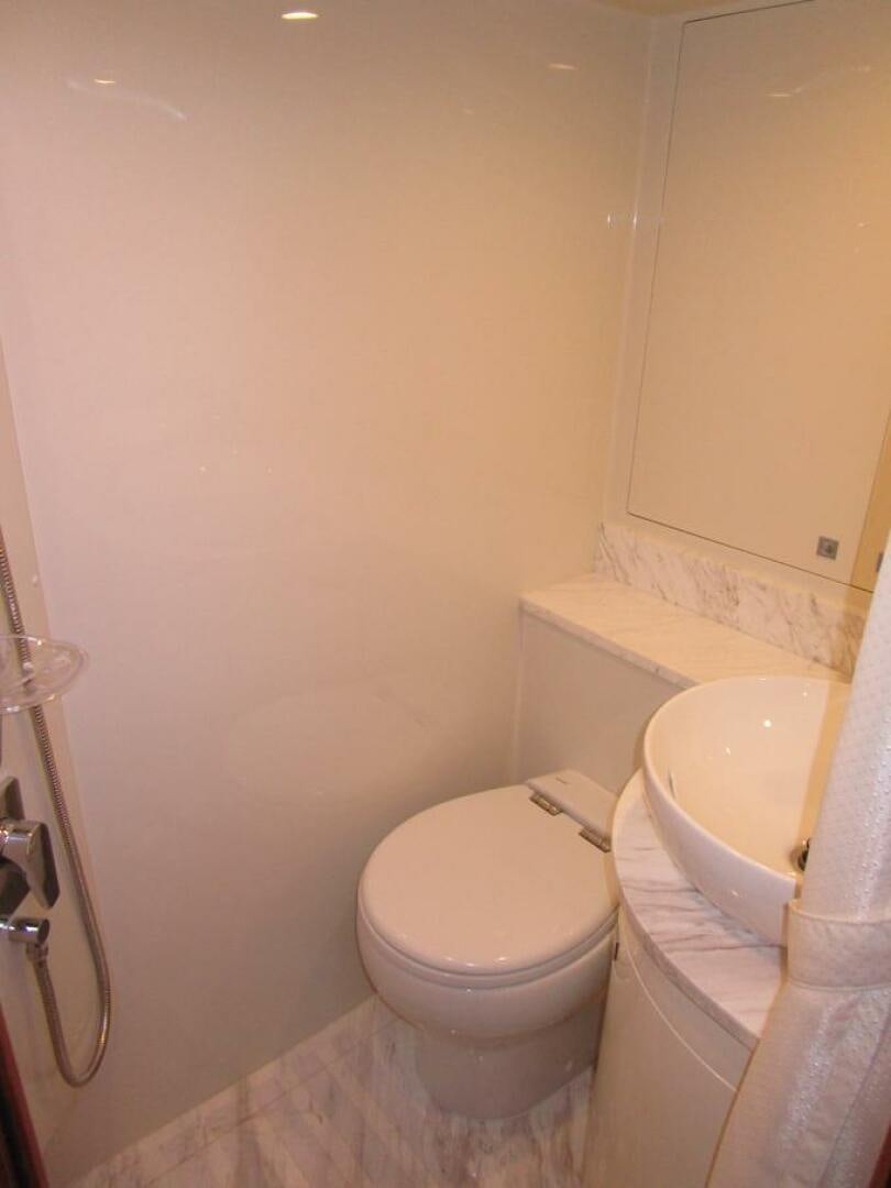 a toilet with a sink aboard NEW 70 JOHNSON Yacht for Sale