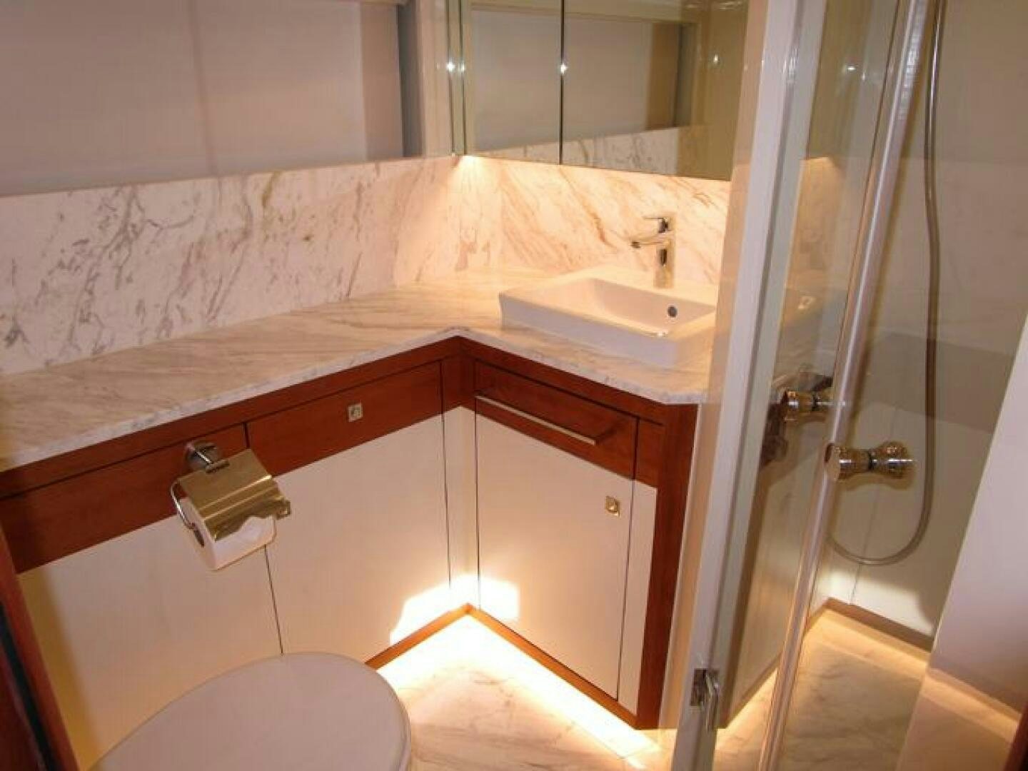 a bathroom with a sink and a shower aboard NEW 70 JOHNSON Yacht for Sale