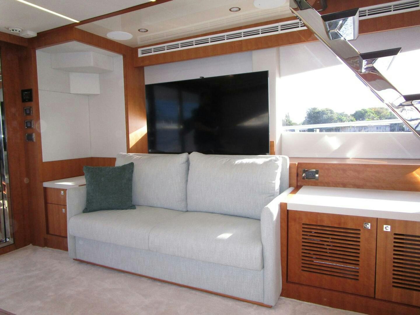 a living room with a couch aboard NEW 70 JOHNSON Yacht for Sale