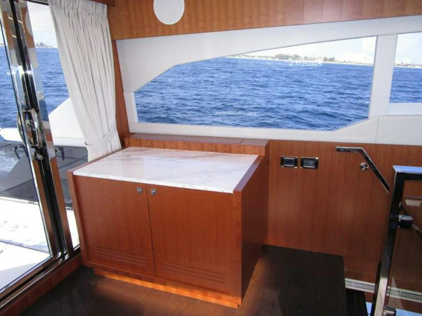 a room with a bed and a window aboard NEW 70 JOHNSON Yacht for Sale