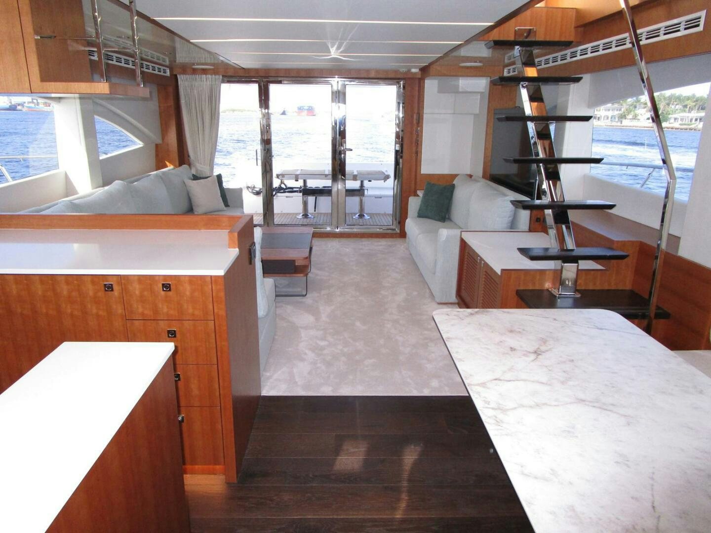 a room with a bed and a table aboard NEW 70 JOHNSON Yacht for Sale