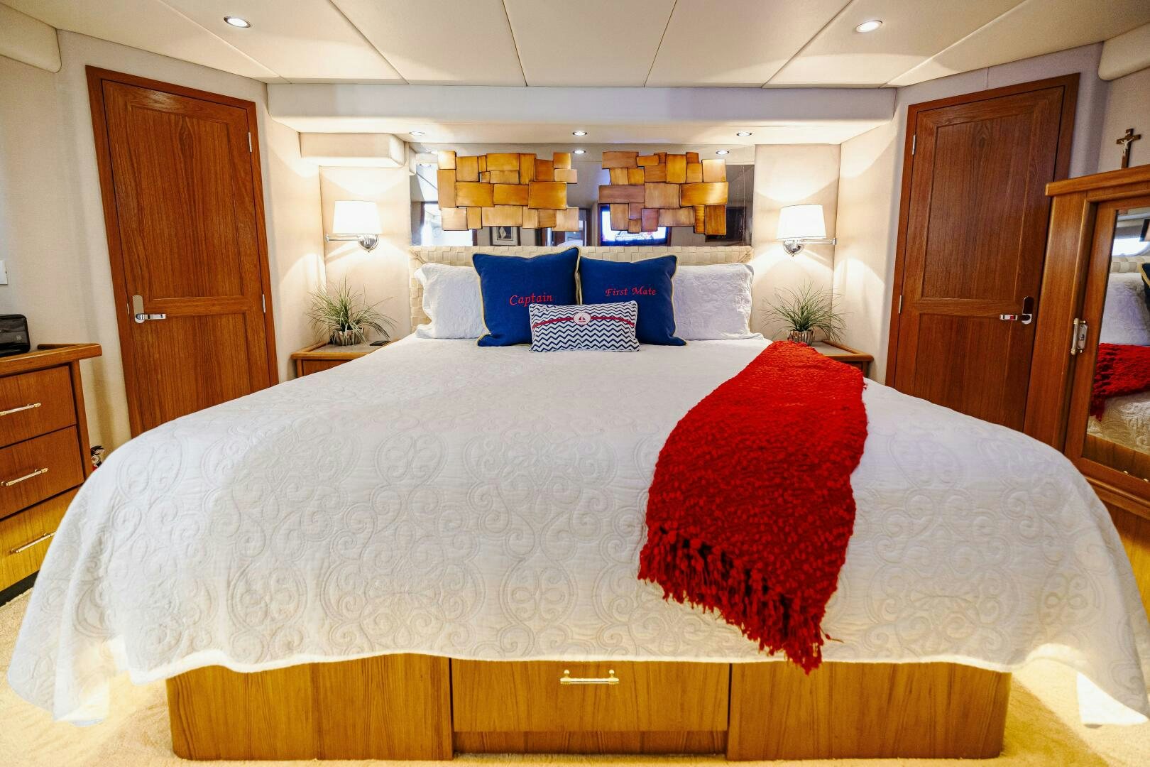 a bed with white sheets and pillows aboard LADY LETICIA V Yacht for Sale