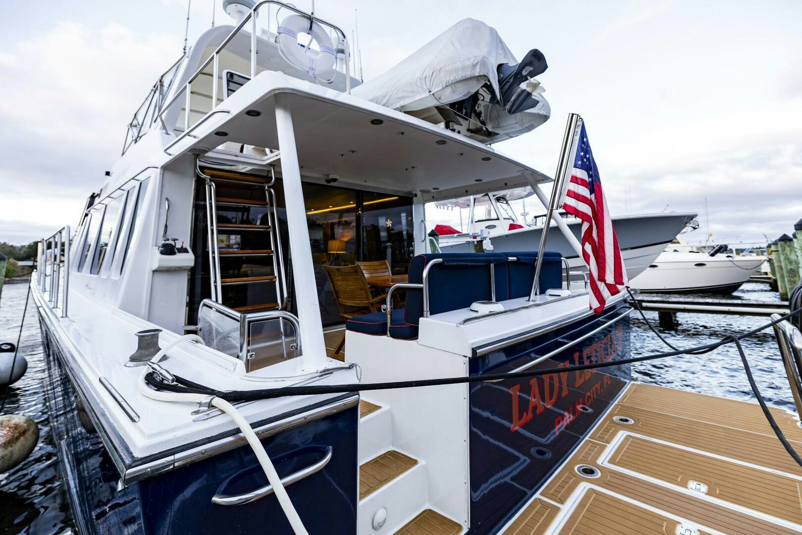 a boat with a flag on the front aboard LADY LETICIA V Yacht for Sale