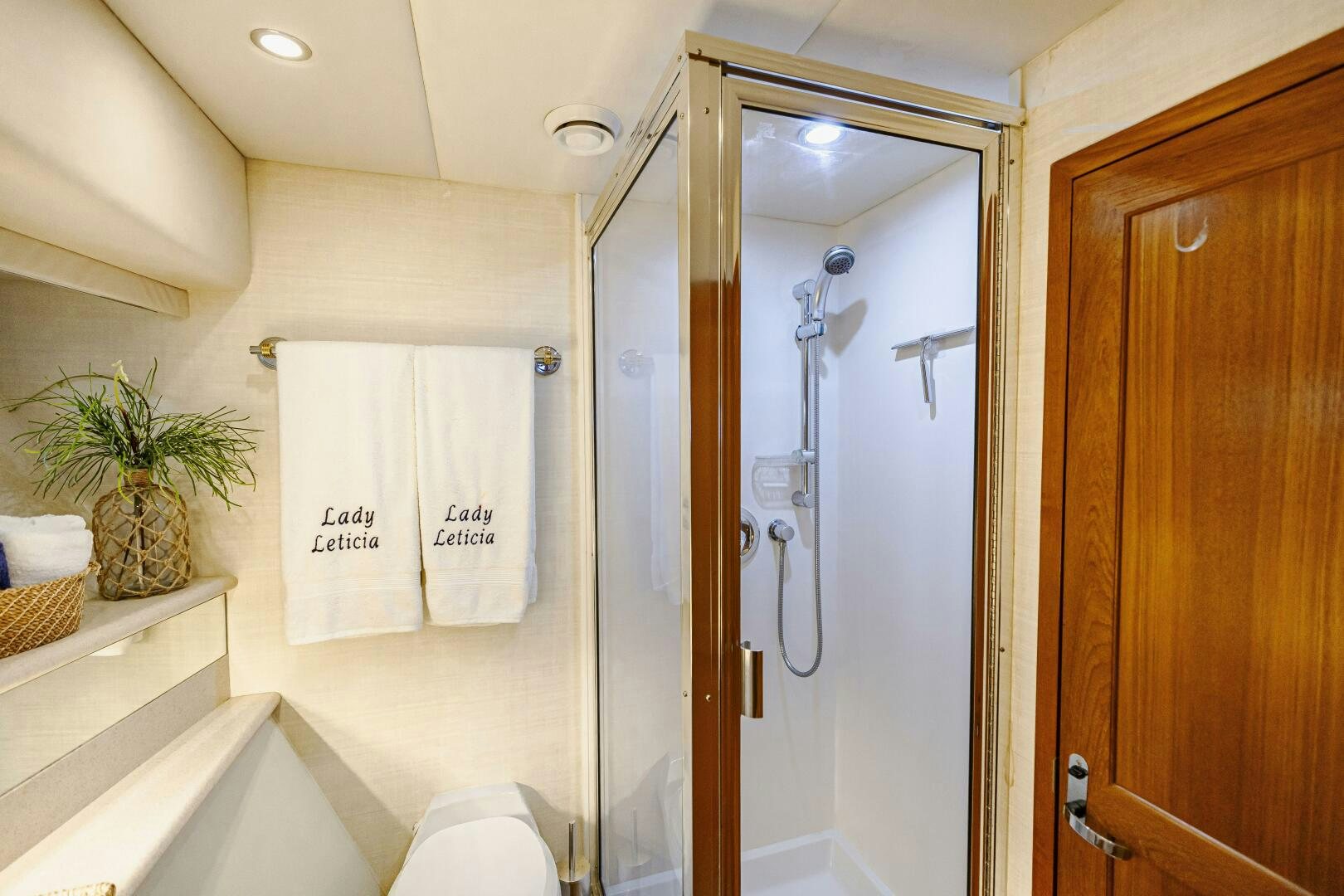 a bathroom with a shower and a sink aboard LADY LETICIA V Yacht for Sale