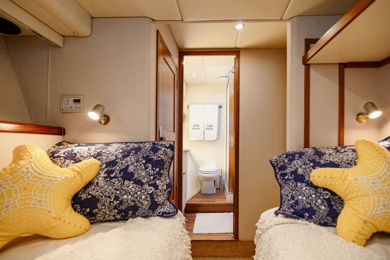 a bedroom with a bed and a closet aboard LADY LETICIA V Yacht for Sale