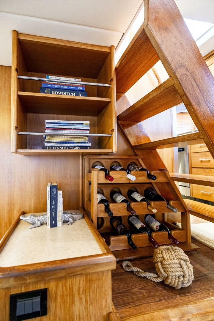 a wooden shelf with electronics aboard LADY LETICIA V Yacht for Sale